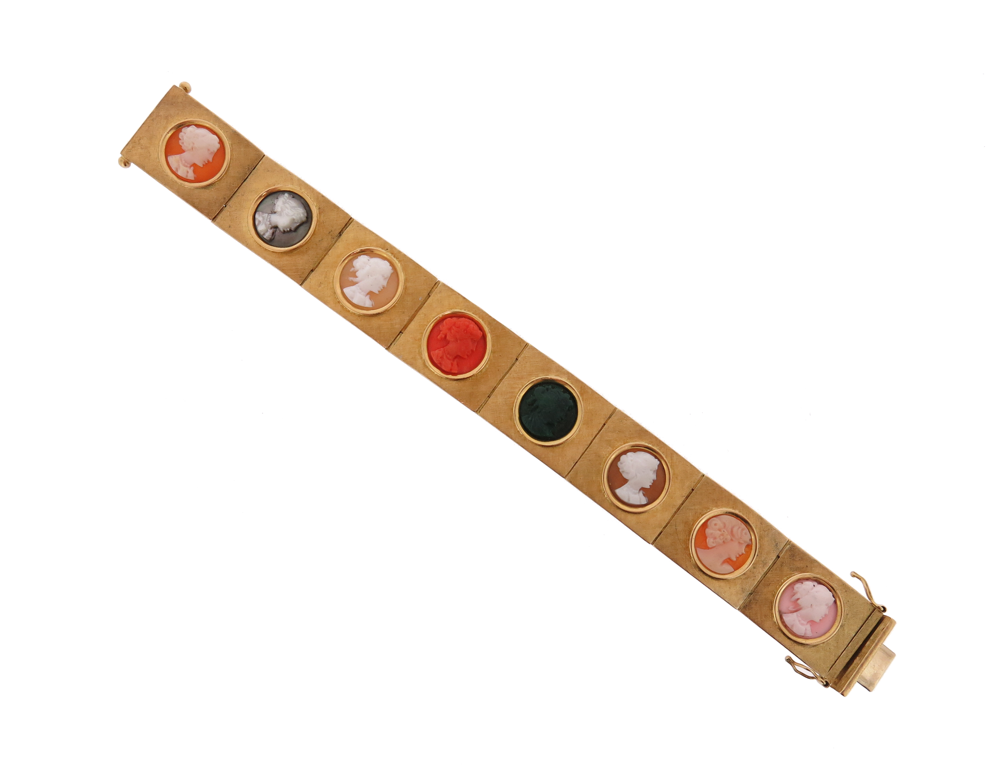 A gold cameo bracelet c.1970, each textured gold rectangular link set with a carved cameo of a
