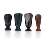 A collection of hardstone desk seals, the four banded agate seals with carved decoration, each