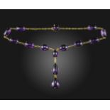An amethyst-set gold necklace, set with oval and pear-shaped amethyst cabochons in gold mounts, 40cm
