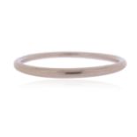 A white gold bangle by Tiffany & Co., signed, stamped '750 Italy', 6cm internal diameter, 16.5g
