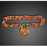 A Victorian coral and gold bracelet, set with alternating fancy coral and gold links with a carved