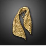 A gold 'scarf' brooch by Mauboussin, c.1950s, designed as an openwork woven scarf in gold, signed