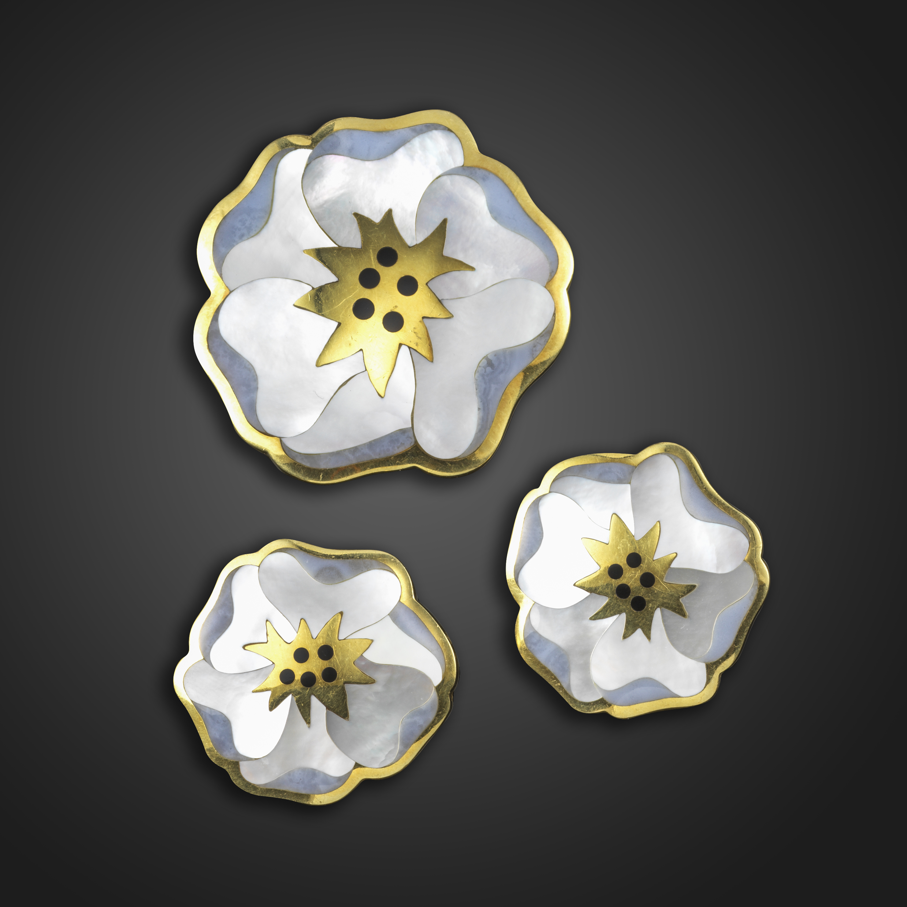 A suite of gem-set gold pansy jewellery by Tiffany & Co., c.1980, comprising a brooch and a pair