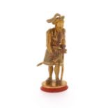 A 19th century gilt metal desk seal, the gilt metal figure of a 16th century gentleman mounted on an