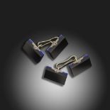 A pair of French black onyx and lapis lazuli cufflinks, the rectangular plaques mounted in white