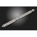 A diamond and gem-set platinum bracelet, centred with three marquise-shaped diamonds, the