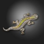 A late 19th century lizard brooch, of realistic gecko form and pavι-set with graduated circular-