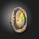 A Russian diamond and opal-set ring, of abstract design, set with round brilliant-cut diamonds and