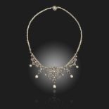 A late 19th century natural pearl and diamond choker necklace, converting to tiara, of scrolling