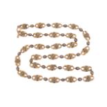 A 19th century gold longuard chain, the repoussé gold links with champlevé enamel foliate motifs,