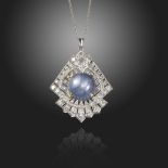 A star sapphire and diamond pendant, of geometric form, centred with a circular star sapphire