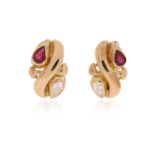 A pair of ruby and diamond earrings, each set with a pear-shaped ruby and diamond in twisted gold