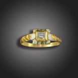 An early 17th century diamond ring, set with a table-cut diamond within a white enamel and yellow