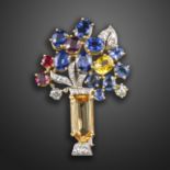 A gem-set giardinetto brooch by Boucheron, set with an orange topaz base, the flowers set with