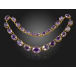 An amethyst rivière necklace, the oval-shaped amethysts in gold with ropetwist decoration, stamped