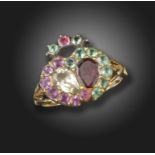 A George III double heart ring, set with a pear-shaped garnet and rock crystal, within a surround of