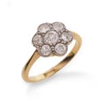 A diamond cluster ring, set with graduated old circular-cut diamonds in platinum and gold, size M