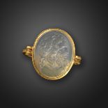 An early 19th century rock crystal intaglio-mounted gold ring, depicting Jupiter in profile,