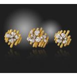 A diamond-set gold ring and earring set, of abstract design, with diamond-set flowerheads on