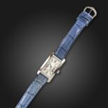 A white gold Tank Amιricaine wristwatch by Cartier, signed cream enamel dial with Roman numerals and