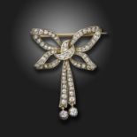 A Victorian diamond-set bow brooch, set overall with graduated old-cut diamonds in silver and