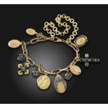 A gold charm bracelet by Dolce & Gabbana, the plain and textured gold oval links suspending