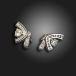 A pair of diamond-set abstract cufflinks by Larry, each set with a round brilliant-cut diamond and