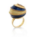 An enamelled gold ring, the sphere with blue and yellow enamel and gold ropetwist decoration, set in