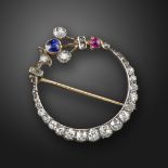 A Victorian gem-set crescent brooch, set with graduated old circular-cut diamonds, a sapphire and