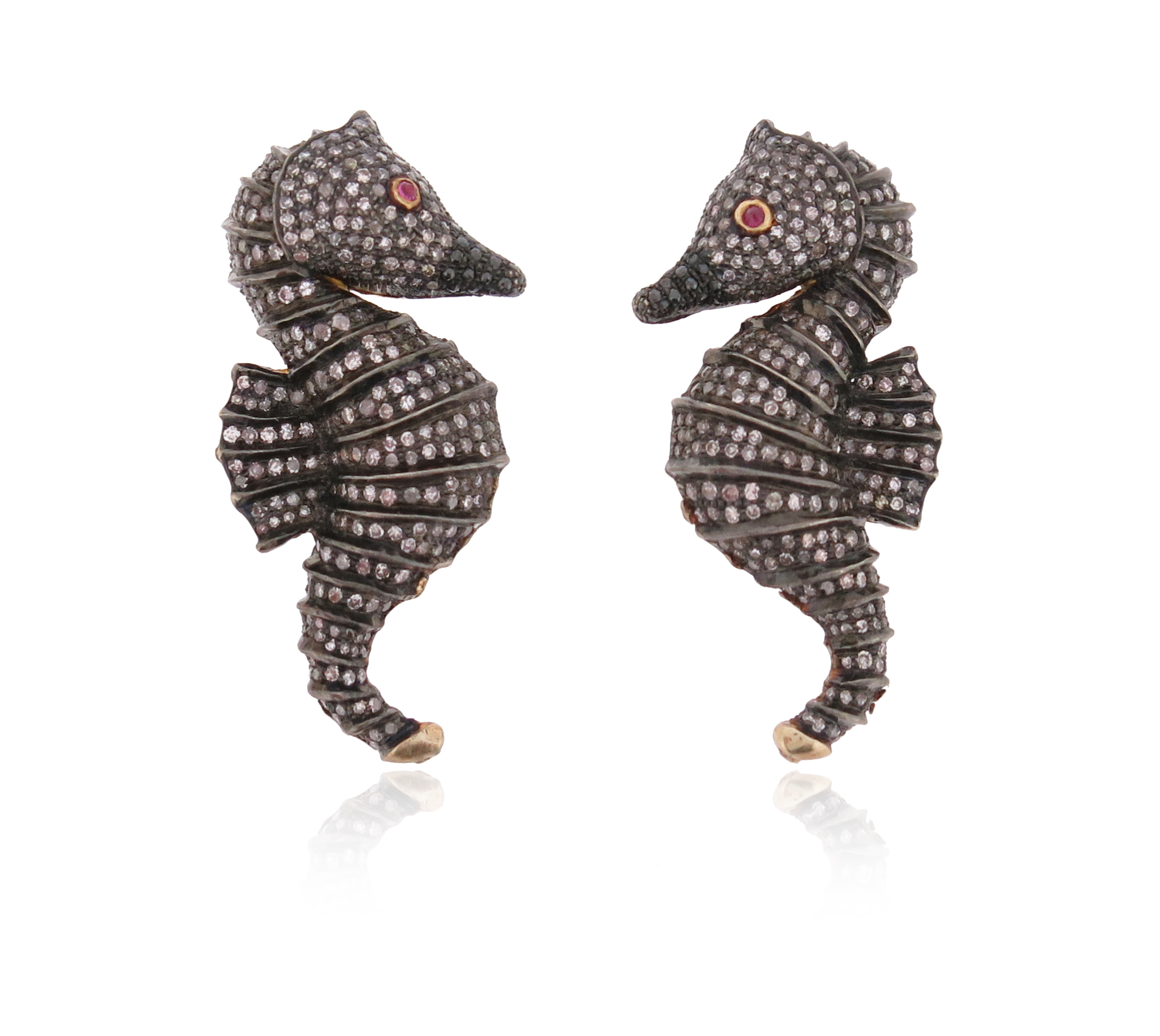 A pair of diamond-set seahorse earrings, pavè-set with single-cut diamonds and a pink-stone eye in