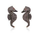 A pair of diamond-set seahorse earrings, pavè-set with single-cut diamonds and a pink-stone eye in