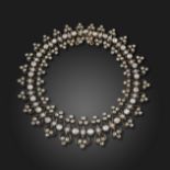 A late 19th century diamond bracelet, set with graduated old circular-cut diamonds, between openwork