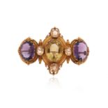 A Victorian citrine and amethyst gold brooch, the central oval-shaped citrine is quartered with