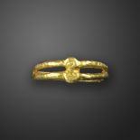 An Ostrogothic gold ring, c.5th-6th century AD, with circular central motif with bifurcated