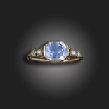 A George III sapphire and diamond ring, centred with a cushion-shaped sapphire with rose-cut