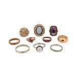 A collection of ten rings, including an amethyst-set gold ring, size M 1/2, a diamond-set two-colour