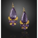 A pair of mid 19th century amethyst and gold earrings, the pear-shaped amethysts are set above