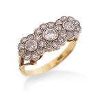 A diamond triple cluster ring, set with three graduated old circular-cut diamonds within a