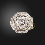 A diamond cluster ring, the octagonal-shaped plaque with pierced decoration, millegrain-set with