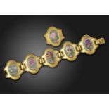 A 19th century French gold panel bracelet mounted with five painted foliate plaques,