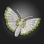 A demantoid garnet and diamond butterfly brooch, pave-set with graduated circular-cut diamonds, with