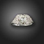 An Art Deco diamond solitaire ring, the old circular-cut diamond is set within a square surround