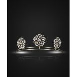 A set of three graduated Victorian diamond brooches mounted as a tiara, the cinquefoil clusters