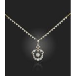 A late 19th century diamond pendant, the foliate scroll pendant set with graduated old circular-