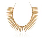 A gold amuletic necklace by Dima Rashid, the links in the shape of stylised yasmin buds in
