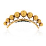 λ A mid 19th century gilt metal hair ornament, the graduated spheres set on a tortoiseshell comb,