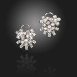 A pair of diamond flowerhead cluster earrings, set with circular-cut foliate diamond clusters and