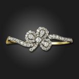 A late Victorian diamond-set convertible bangle, the shamrock centre section set with old circular-