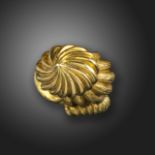 An abstract gold ring, designed as a swirl in textured yellow gold, size K approximately