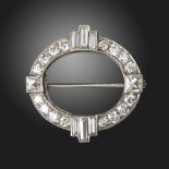 An Art Deco diamond brooch, of oval form, set with old circular-cut diamonds and quartered with